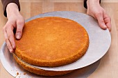 Slide the top half of the divided cake base onto a decorating plate
