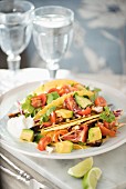 Tacos filled with pork, coleslaw, avocado and tomato salsa