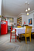 Colourful furniture and dining table in kitchen of period building