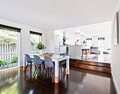 Open living room with dining area and higher kitchen