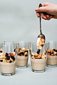 Cashew cream with fruit in glasses