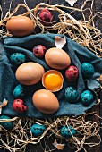 Colorful Easter eggs on wooden background