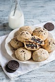 Chocolate chip cookies with Oreos and a bottle of milk