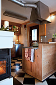 Cosy country-house kitchen with chequered floor