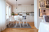 White kitchen-dining room in country-house style