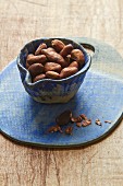 Cocoa beans in a ceramic bowl