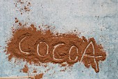 The word 'Cocoa' written in cocoa powder