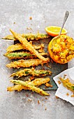 Asparagus tempura with orange and mango chutney