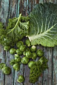 Various types of cabbage on a wooden background