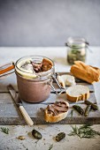 Homemade chicken liver pate with french bread and cornichons
