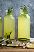 Lemonade flavored with mint and rosemary served in a bottle