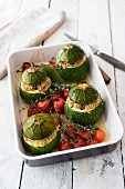 Zucchini filled with quinoa and cherry tomatoes