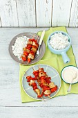 Chicken skewers with tomatoes and peppers with rice