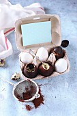 Chocolate eggs filled with egg cream and vanilla pudding