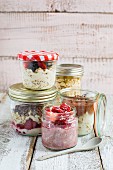 Different varieties of overnight oats in glass jars