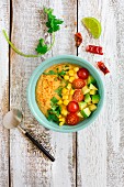 A savoury smoothie bowl with sweetcorn, avocado, tomatoes and chilli