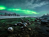 Aurora borealis over a river