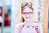 Girl trying on glasses