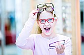 Girl trying on glasses