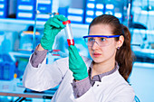 Scientist holding test tube