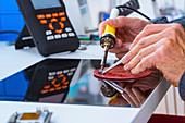 Person soldering an electronic component