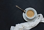 A cup of coffee on a black background