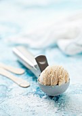 Salted caramel ice cream on an ice cream scoop