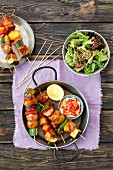 Chicken, potato and vegetable skewers with a side serving of lettuce
