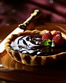 A chocolate tart with raspberries (close-up)