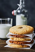 A stack of dark and light almond cookies