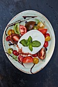 Tomatoes with mozzarella and basil