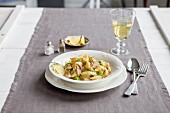 Pasta shells with tarragon and fennel served with trout in anise sauce