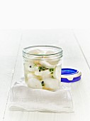 Lacto fermented daikon radishes in a mason jar