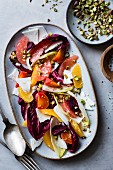 Citrus fruit and chicory ricotta salata with pistachios