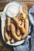 A churro, a fried dough sweet pastry based snack