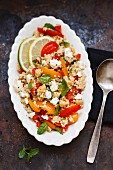 Quinoa salad with chickpeas, tomatoes, peppers and sheep's cheese
