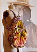 Rucksack made from colourful velvet and ruffles on tailors' dummy