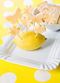 Flower and butterfly shaped cheese skewers served with crackers