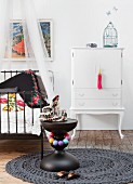 Ethnic ambiance and white cabinet in child's bedroom