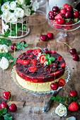 A summery cheesecake topped with berry and cherry jelly
