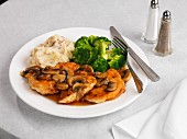 Sliced chicken in Marsala sauce with broccoli and mashed potatoes