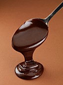 Chocolate sauce running off a spoon