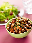Brown beans with chives in a small bowl