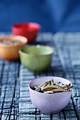 Edible mealworms in porcelain bowls