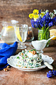 Salad with onion, cheese and walnuts with yogurt dressing