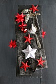 Hand-made Christmas arrangement of various 3D paper stars and origami stars