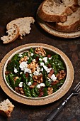 Spinach salad with bacon, walnuts and sheep's cheese