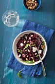 Raw spiralized beet salad with goat cheese and walnuts