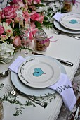 Place settings with painted hearts on a festively laid table