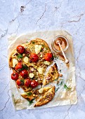 Brioche pizza with fennel, cherry tomatoes, bocconcini, figs and hazelnuts